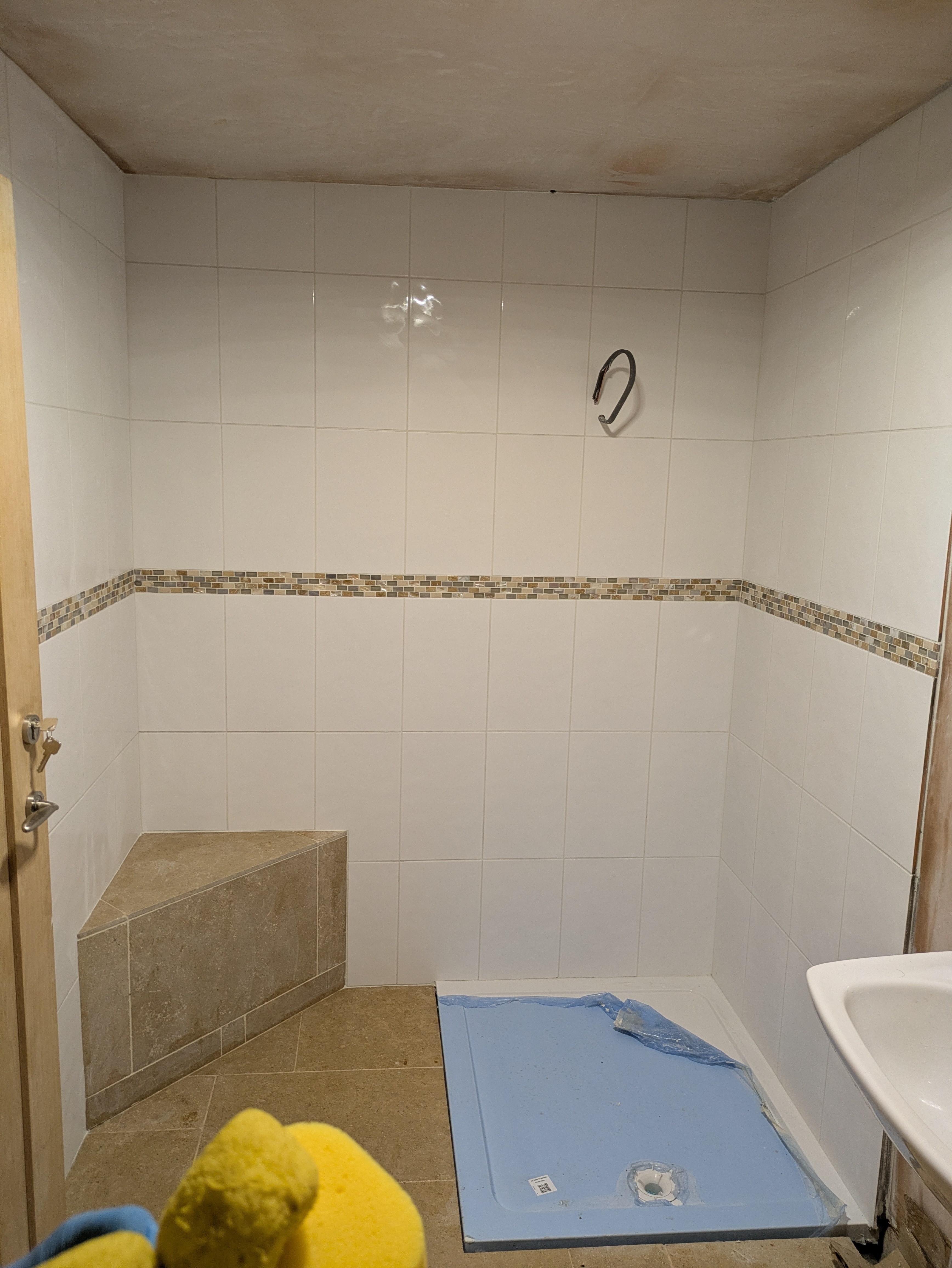 Bathroom corner seat installation